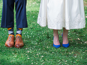 Ashley & Josh show their decorative socks and beautiful bridal shoes in Ann Arbor