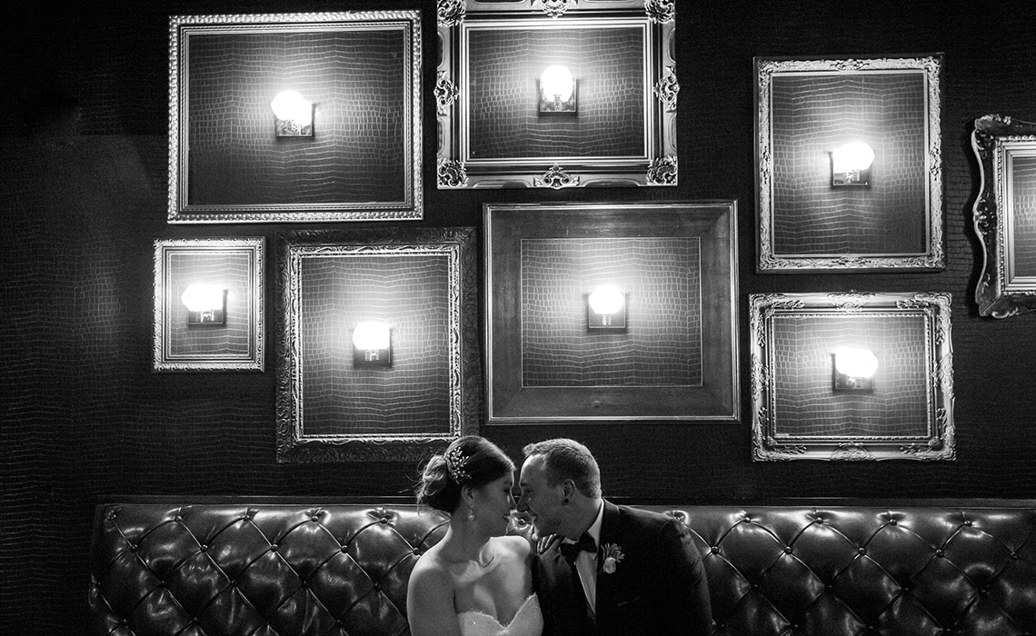 Gabby & Aaron celebrate their love in the romantic shadows of the Gatsby Bar after their Kalamazoo, Michigan wedding ceremony.