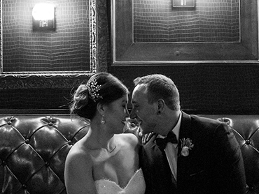 Gabby & Aaron celebrate after their Kalamazoo, Michigan wedding ceremony at the Gatsby bar.